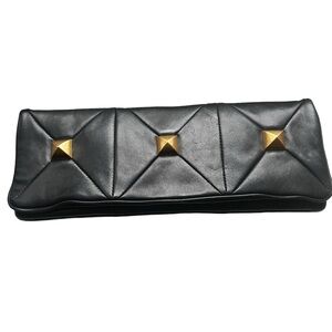 1980’s black and gold colored faux leather clutch